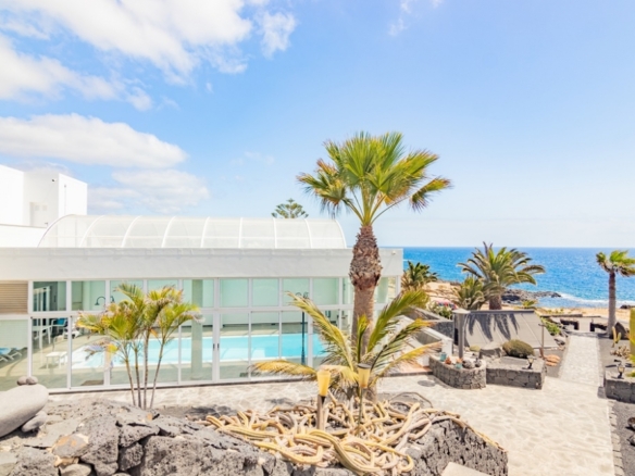 A Rare Coastal Jewel: Luxury Residence with Beach Access in El Charco del Palo – photo 1